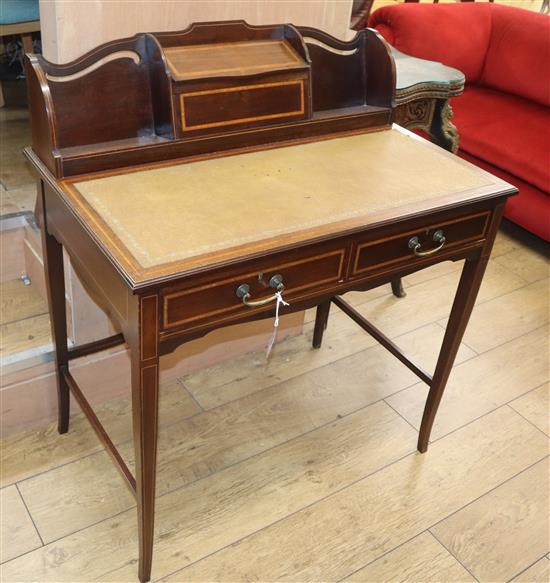 An Edwardian satinwood banded mahogany desk W.84cm